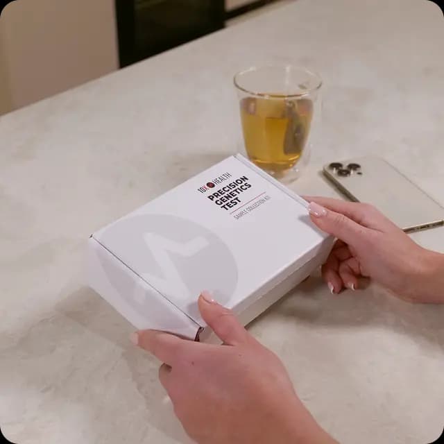 A 10X Precision Genetics test box being opened on a countertop